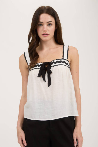SLEEVELESS WAVY TRIM FRONT SPLIT WITH TIE BLOUSE