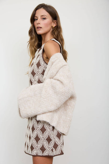 TEXTURED GEOMETRIC SLEEVELESS MINI DRESS